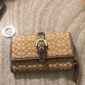 Coach wallet. Has writing inside.